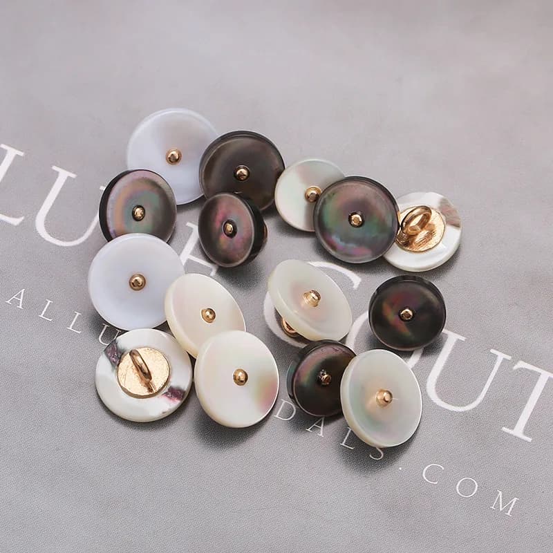 Talobe Black Disc Bass Hand Sewn Button Cuffs Made of Natural Seashells, front view