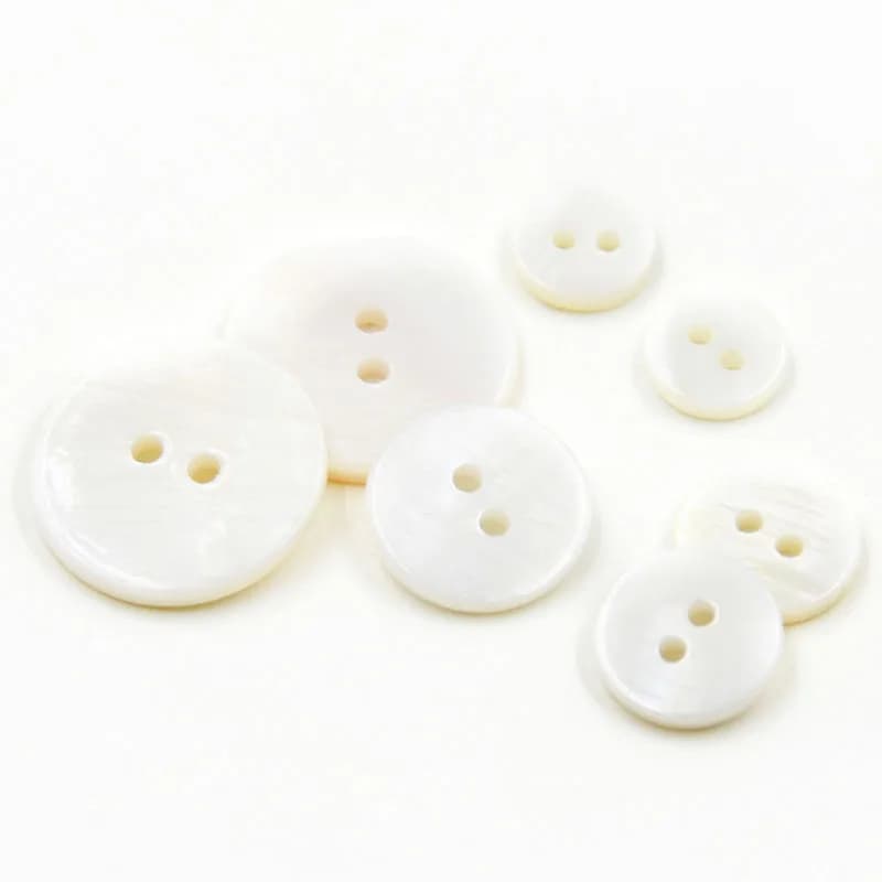 Natural ivory shell buttons from the MANCHAO Alibaba storefront