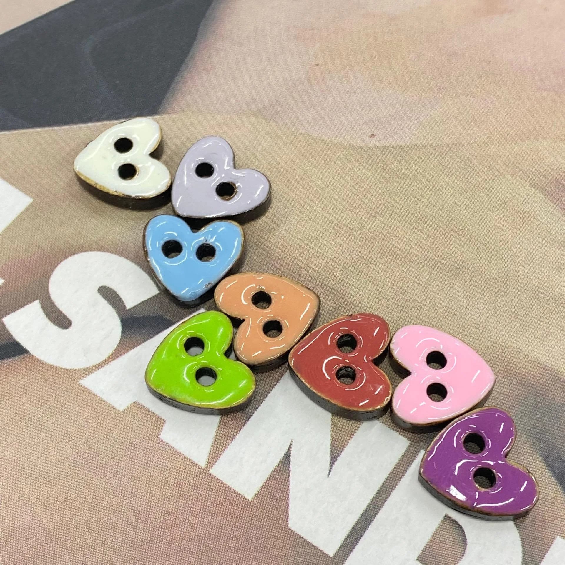 Multicolor 11.5 mm heart-shaped coconut buttons with two sewing holes