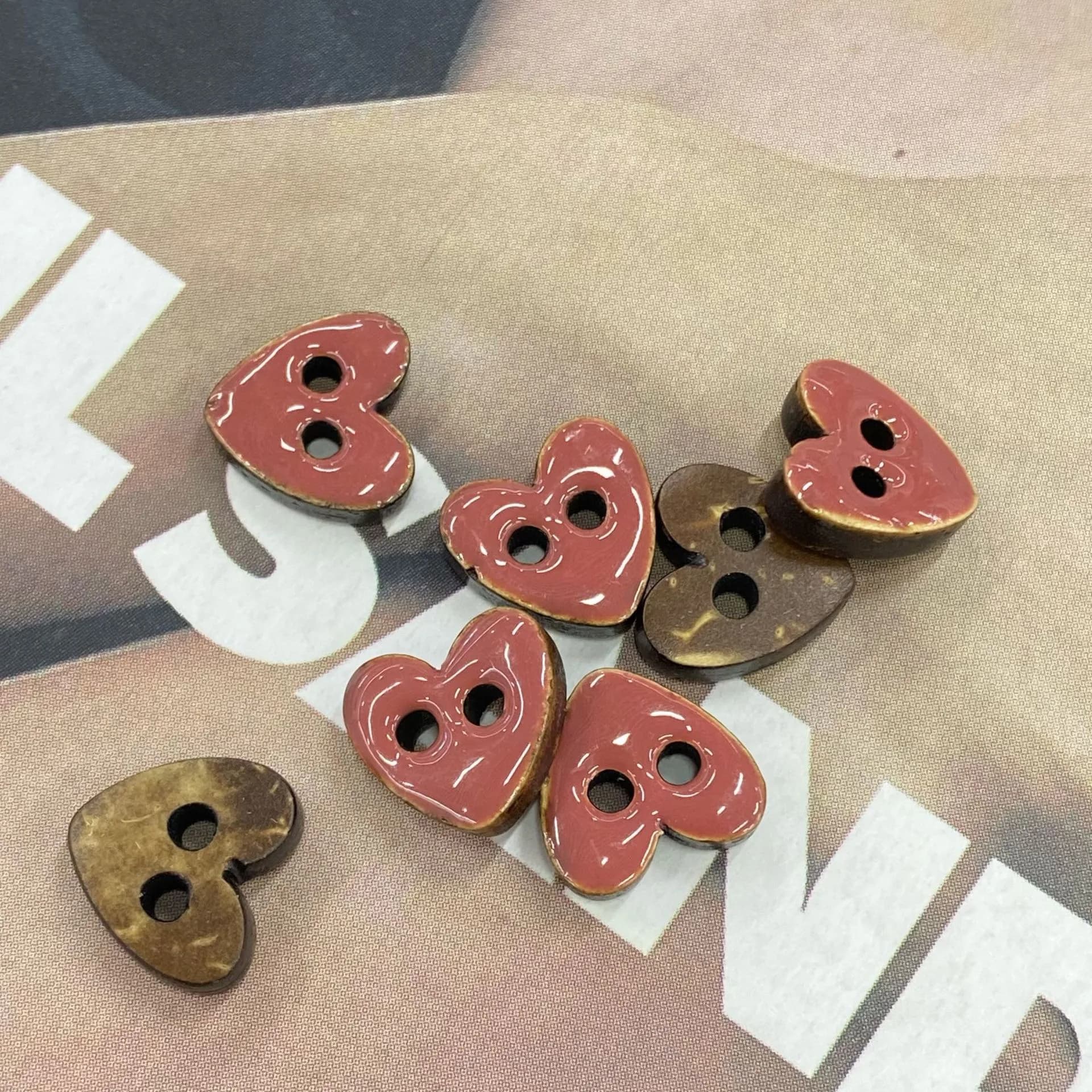 Red coated heart-shaped coconut buttons for apparel